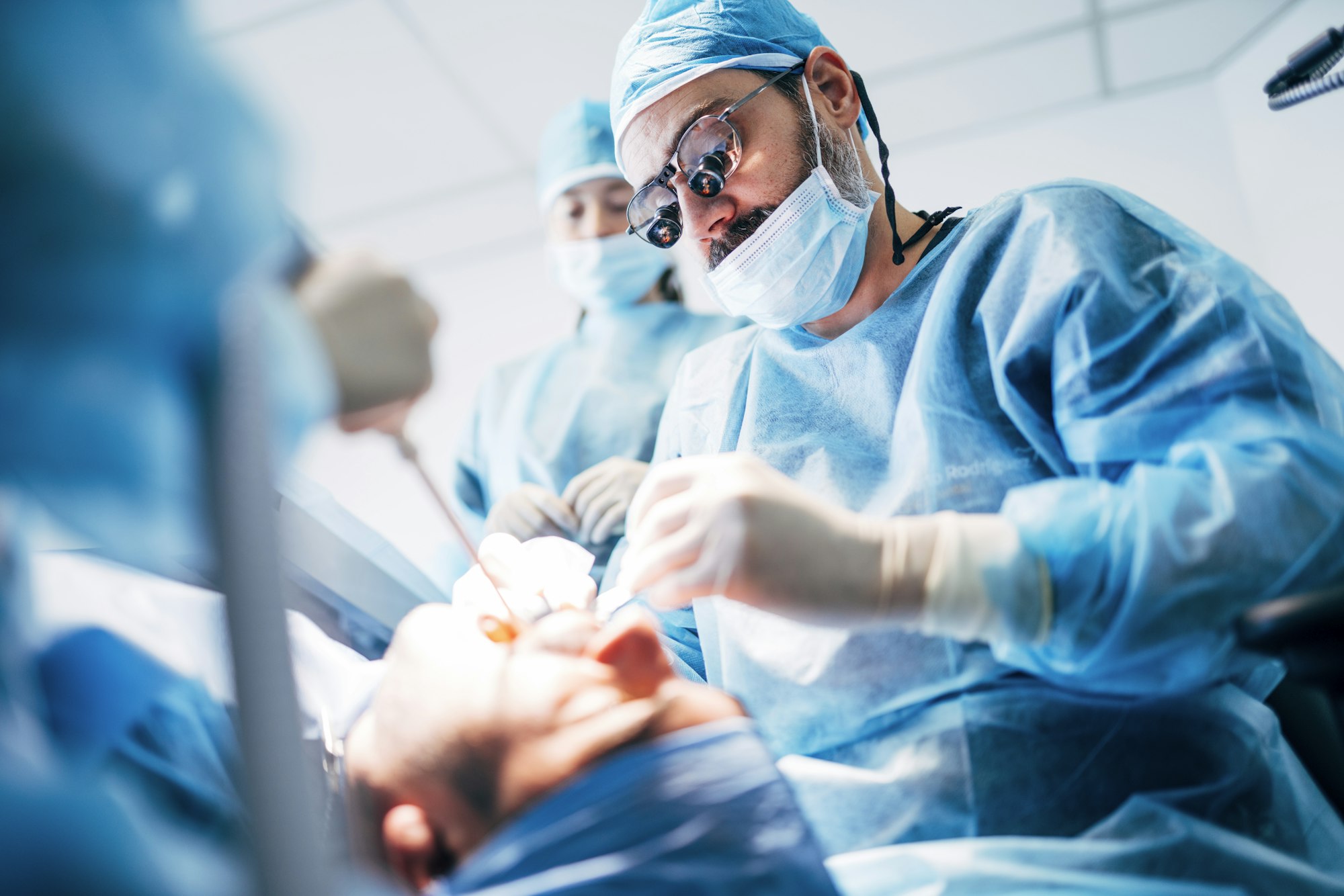 Team dental surgeons working in dental clinic.