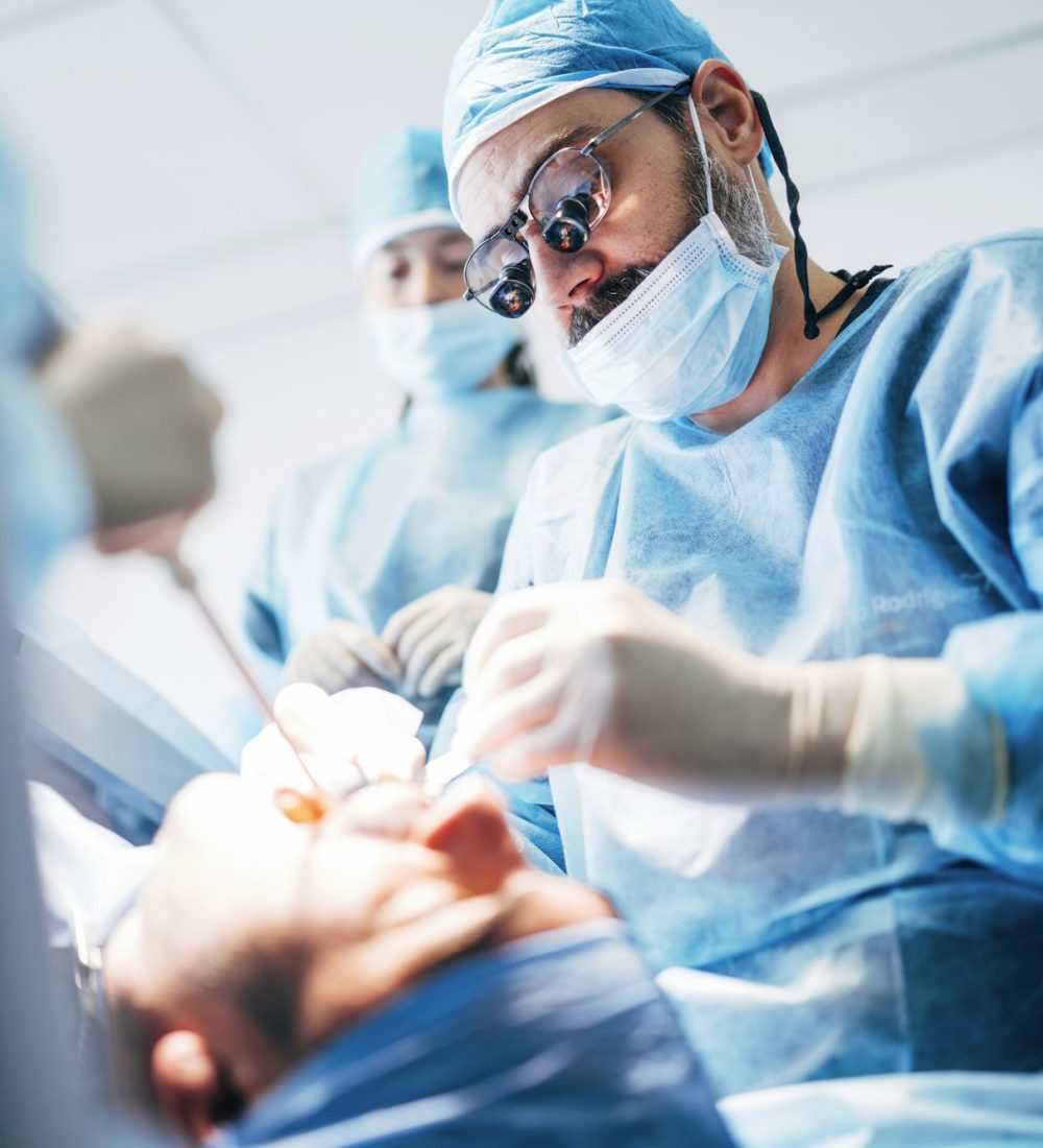 Team dental surgeons working in dental clinic.